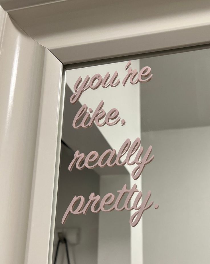 Mirror surface with custom vinyl lettering